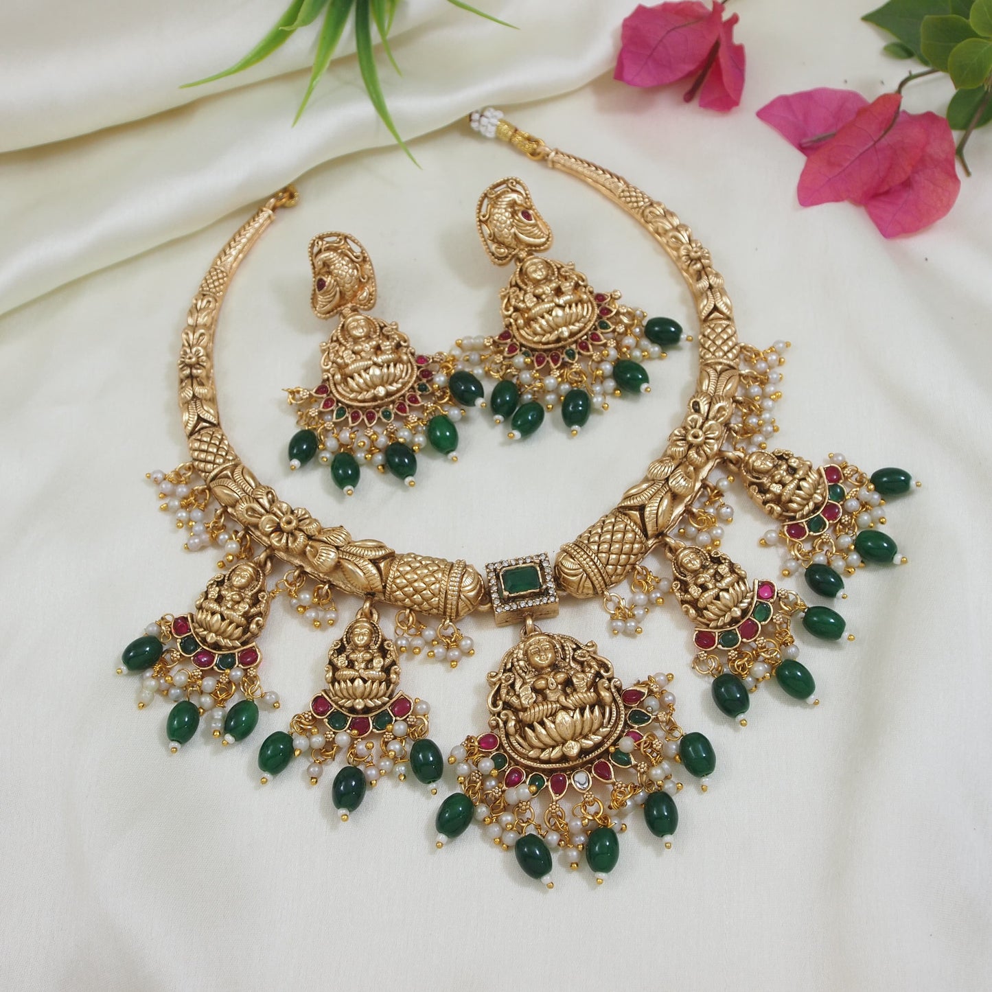 Traditional Gold-Plated Temple Necklace Set with Lakshmi Motifs, Green & Red Stones, and Pearl Accents