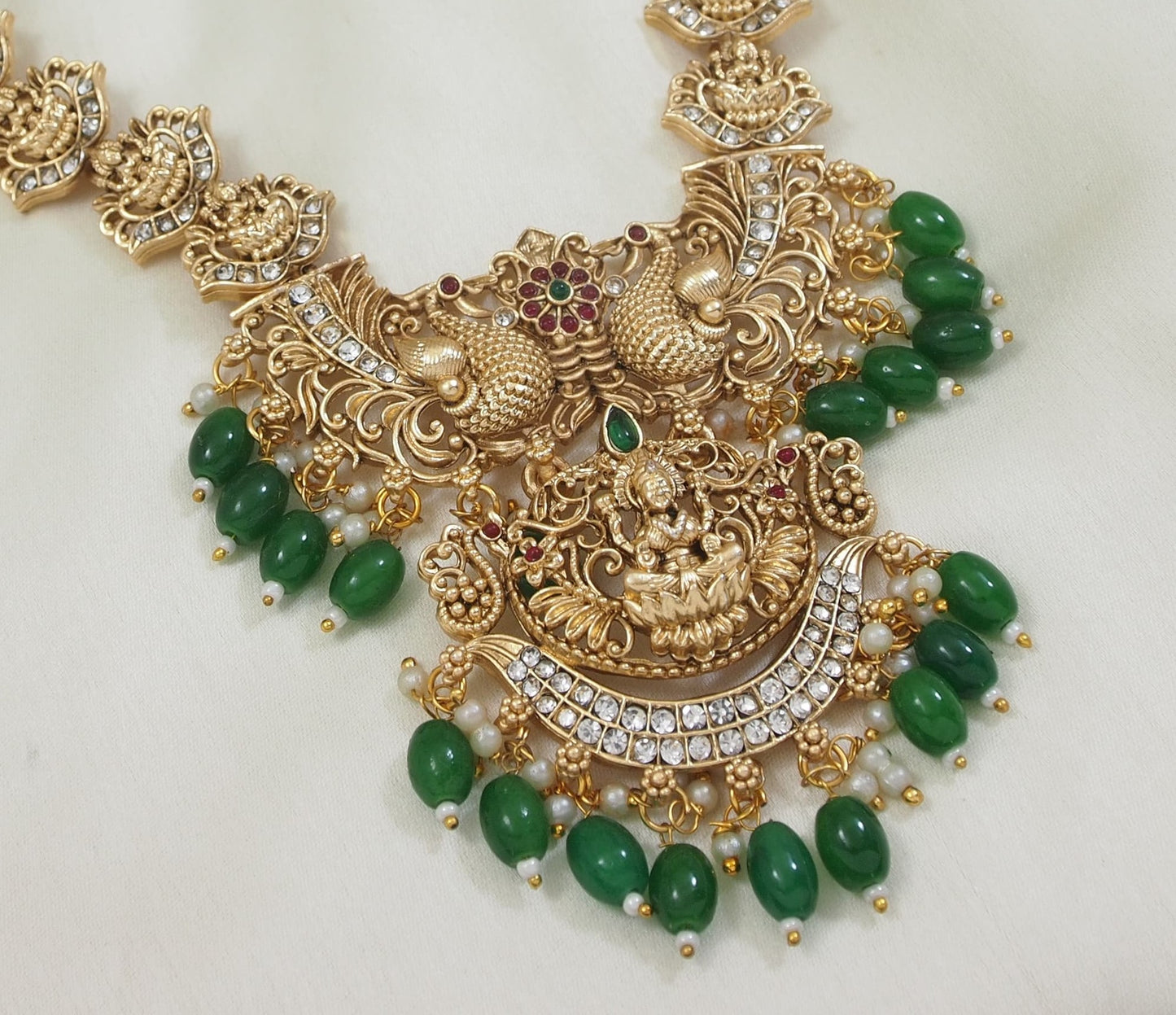 Traditional Peacock Motif Necklace with Green Bead Drops and Jhumkas
