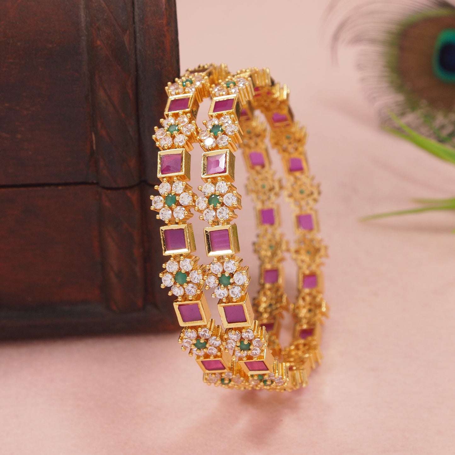 Orna Gold-Plated Floral Design Bangles with Ruby and Green Stone Embellishments - Set of 2