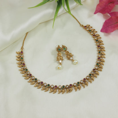 Antique Gold-Plated Leaf Motif Necklace Set with Ruby and Green Stones