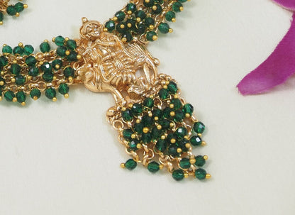 Traditional Gold-Plated Radha Krishna Necklace Set with Pearl Accents and Matching Earrings